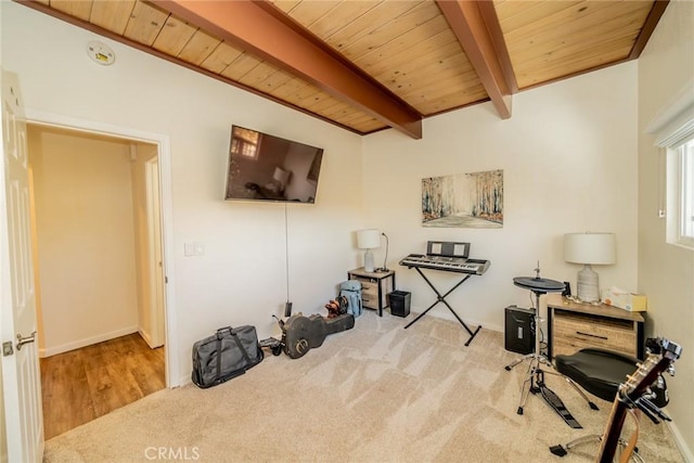 misc room featuring beamed ceiling, wood ceiling, and light wood-type flooring