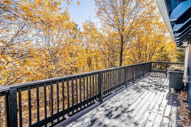 wooden deck featuring area for grilling