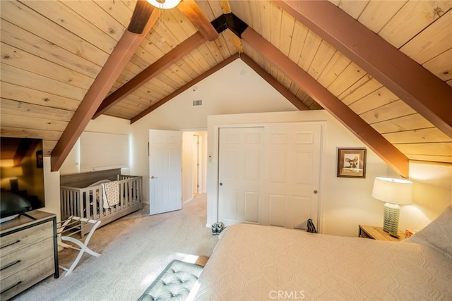 bedroom with vaulted ceiling with beams, ceiling fan, light colored carpet, and wooden ceiling