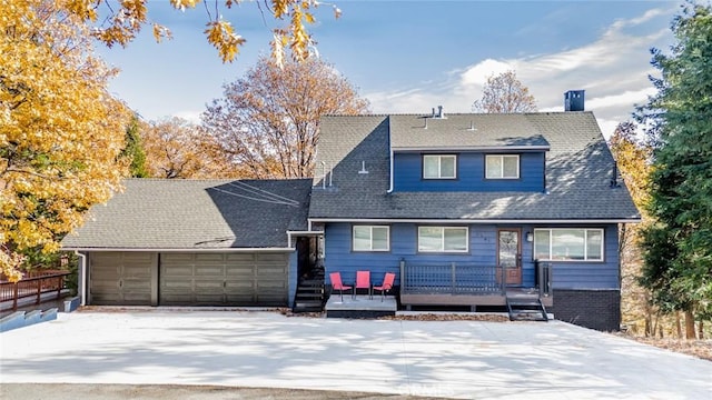 1181 Voltaire Dr, Lake Arrowhead, CA 92352 - view of front of home with a wooden deck, a shingled roof, and an attached garage