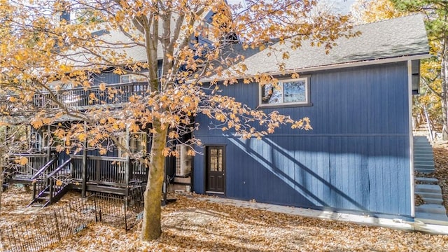 1181 Voltaire Dr, Lake Arrowhead, CA 92352 - back of property with a shingled roof and a deck