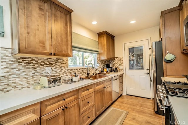 1181 Voltaire Dr, Lake Arrowhead, CA 92352 - kitchen featuring appliances with stainless steel finishes, tasteful backsplash, light wood-style flooring, light countertops, and brown cabinets
