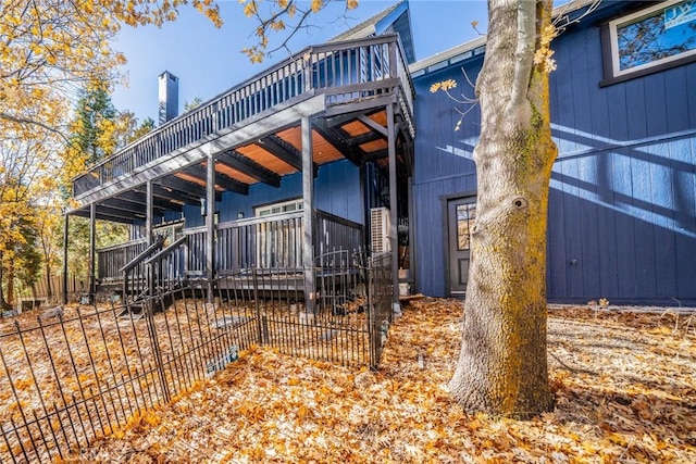 back of house featuring a deck