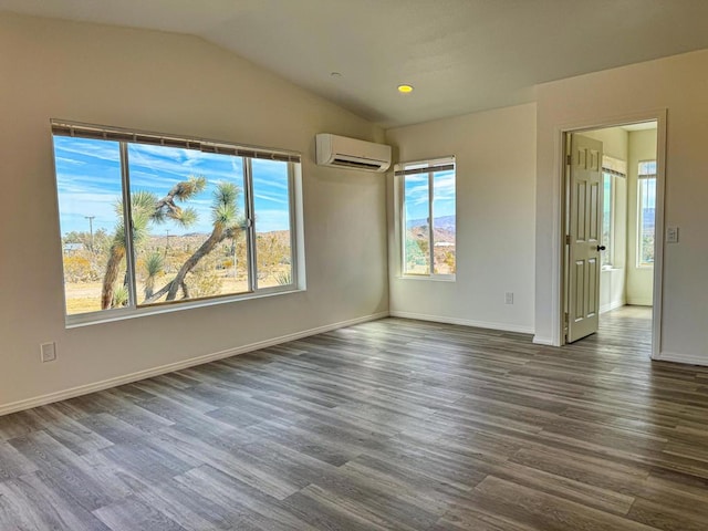 unfurnished room with a wall mounted air conditioner, dark hardwood / wood-style flooring, and lofted ceiling