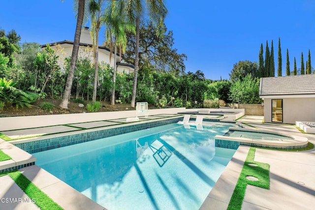 view of swimming pool featuring an in ground hot tub