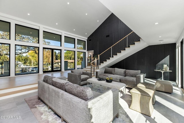 living room with high vaulted ceiling