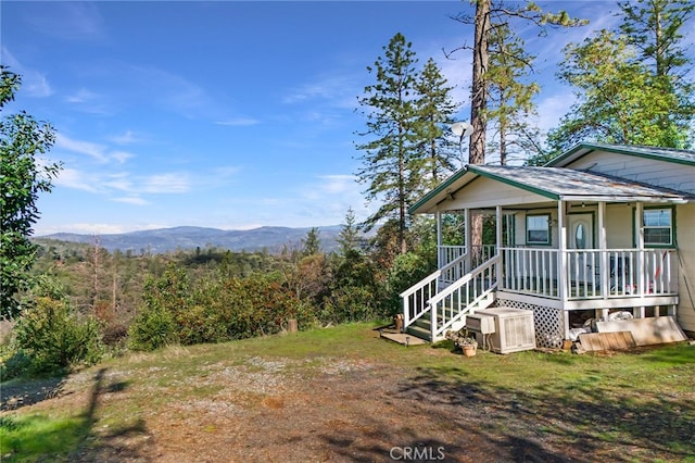 exterior space featuring a mountain view and a porch