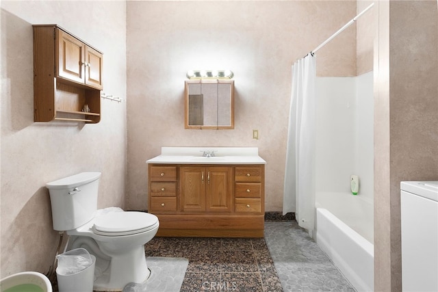 full bathroom with shower / tub combo, vanity, toilet, and washer / dryer