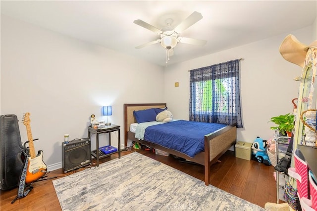 bedroom featuring hardwood / wood-style floors and ceiling fan