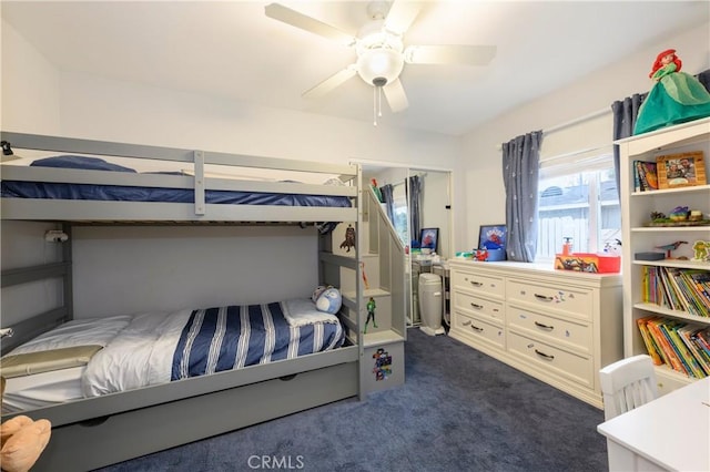 carpeted bedroom featuring ceiling fan