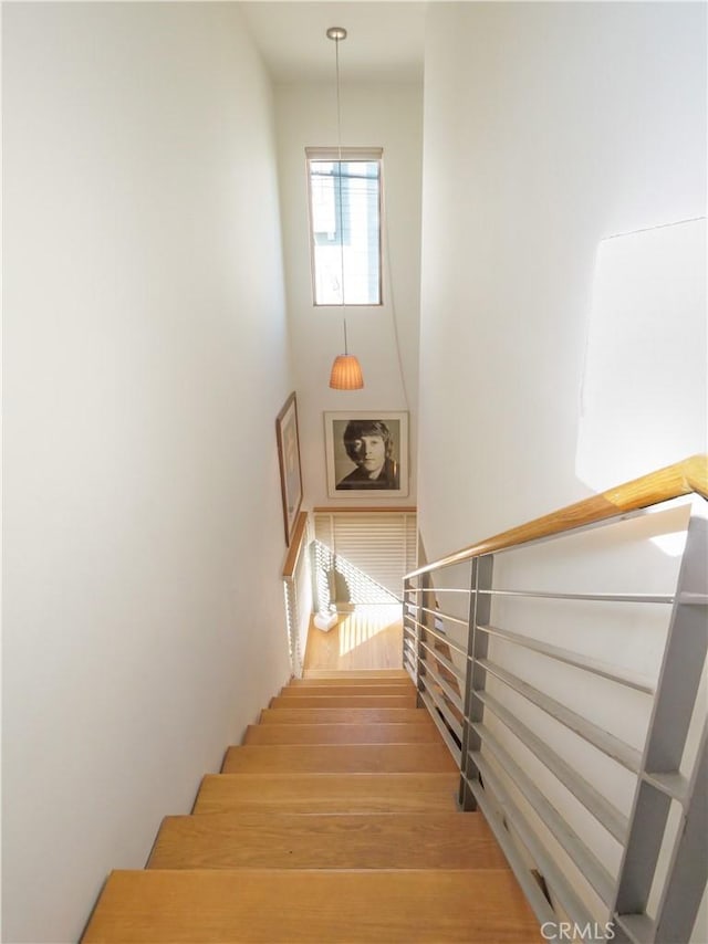 stairs with wood finished floors