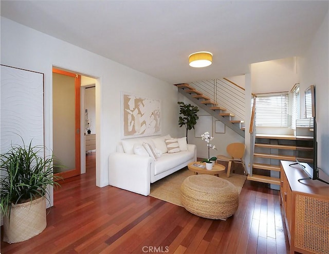 living room featuring stairs and wood finished floors