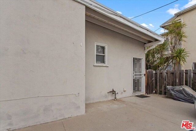 view of side of home with a patio