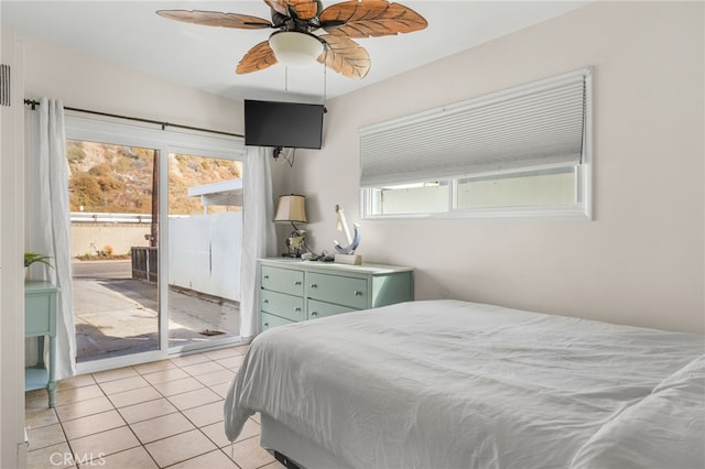 bedroom with light tile patterned floors, access to outside, and ceiling fan