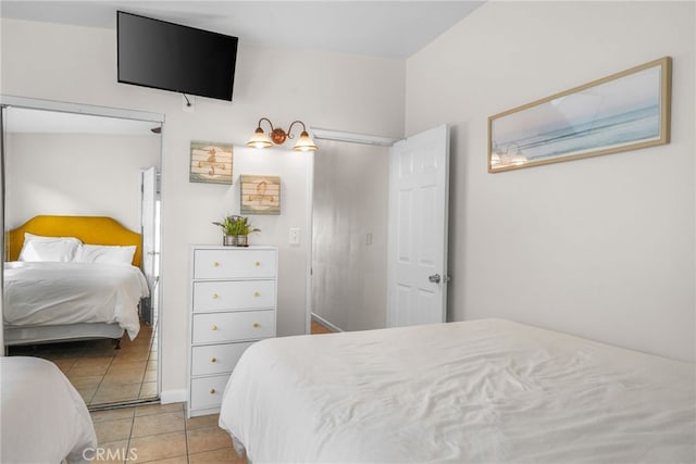 bedroom featuring light tile patterned floors