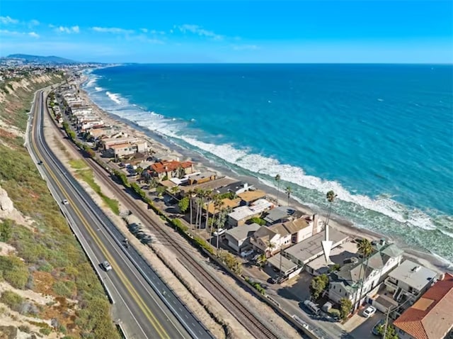 drone / aerial view with a view of the beach and a water view