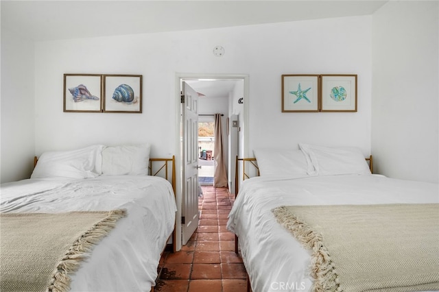 bedroom with dark tile patterned floors