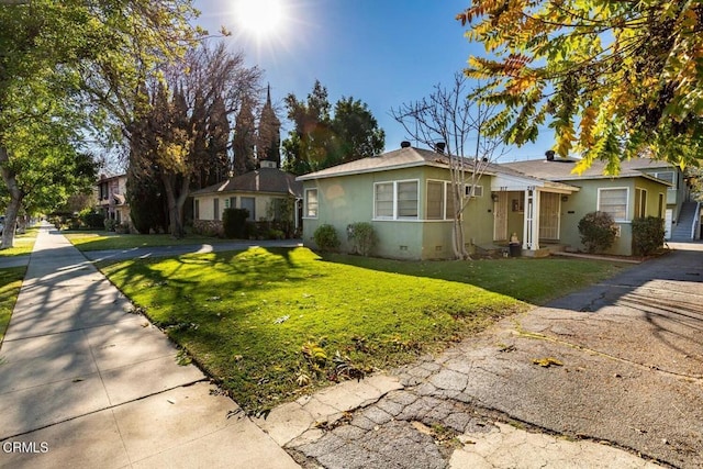 ranch-style house with a front yard