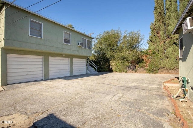 view of side of home featuring a garage