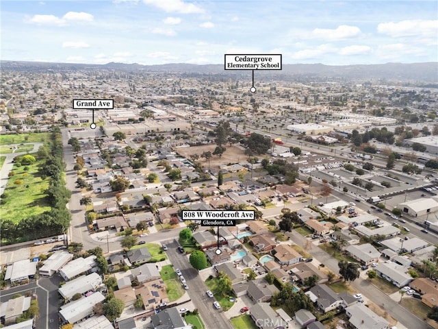 birds eye view of property featuring a mountain view