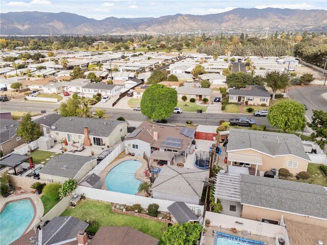 birds eye view of property with a mountain view