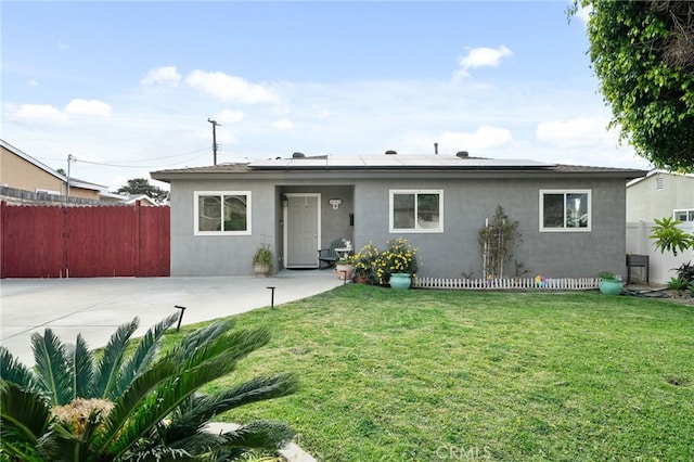 view of front facade featuring a patio and a front lawn