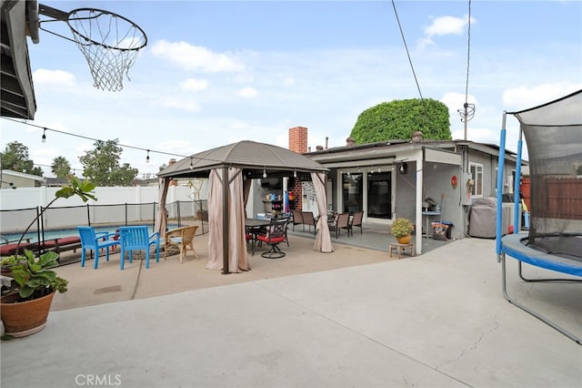 view of patio / terrace with a gazebo and a trampoline