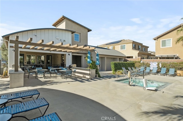 back of house featuring a pergola and a patio