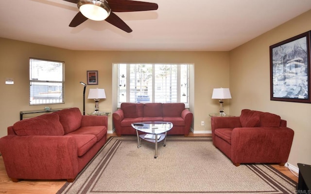 living room with hardwood / wood-style flooring and ceiling fan