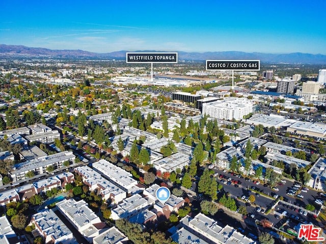 birds eye view of property with a mountain view