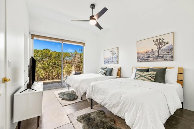 bedroom featuring ceiling fan, access to exterior, and concrete floors