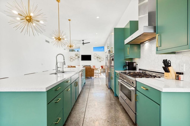 kitchen featuring ceiling fan with notable chandelier, stainless steel appliances, sink, pendant lighting, and range hood