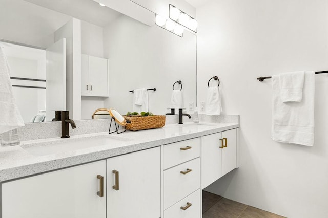 bathroom featuring tile patterned flooring and vanity