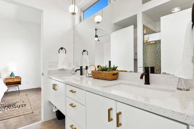 bathroom with tile patterned flooring, vanity, ceiling fan, and an enclosed shower