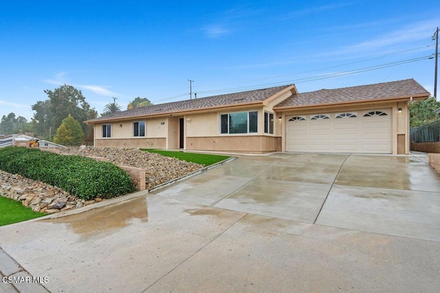 ranch-style home featuring a garage