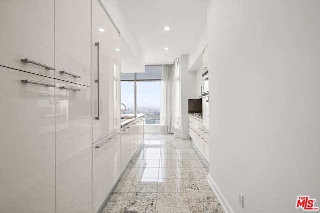 hallway featuring sink