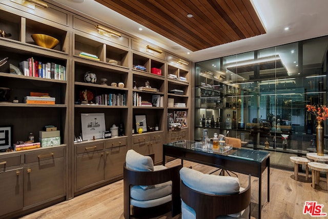 interior space featuring light wood-type flooring and wooden ceiling