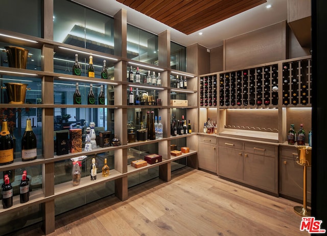 wine room with wooden ceiling and light hardwood / wood-style floors