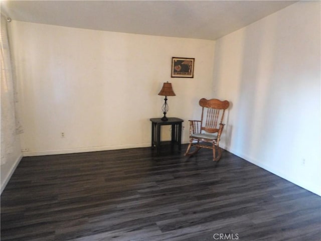 unfurnished room featuring dark wood-type flooring