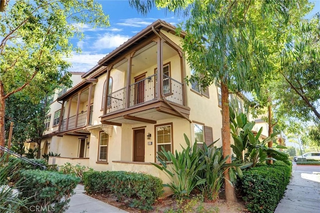 view of front of house featuring a balcony