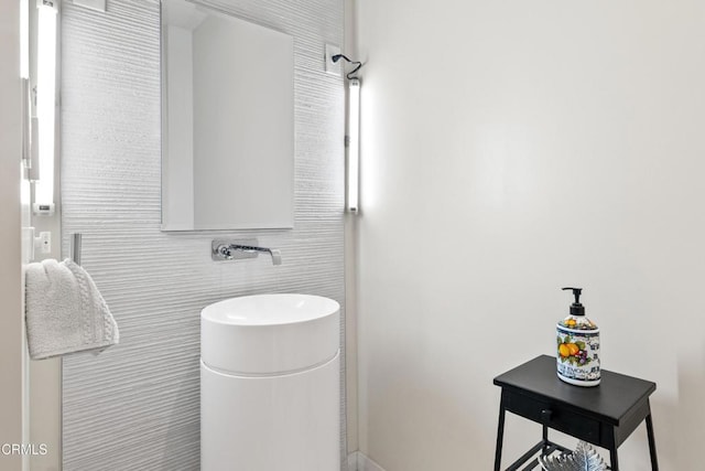 bathroom with tile walls