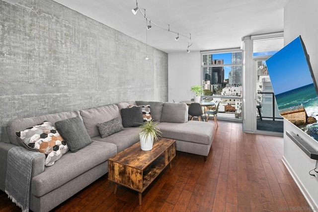 living room with expansive windows and dark hardwood / wood-style flooring