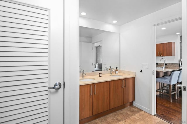 bathroom with wood-type flooring and vanity