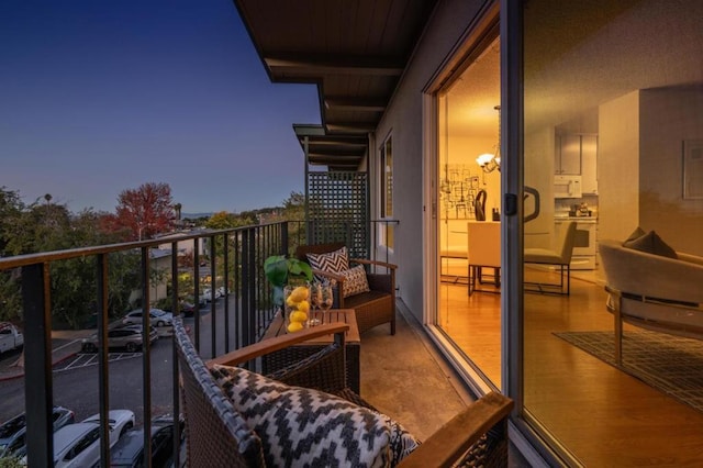 view of balcony at dusk