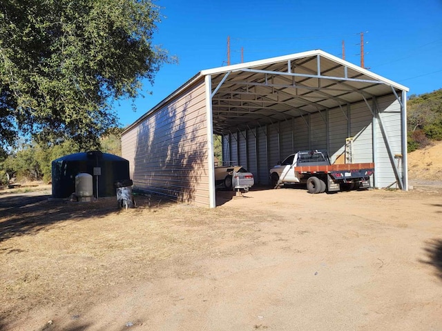 view of outbuilding featuring a carport