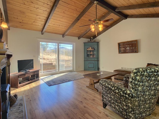 living room with vaulted ceiling with beams, light wood-type flooring, ceiling fan, and wood ceiling