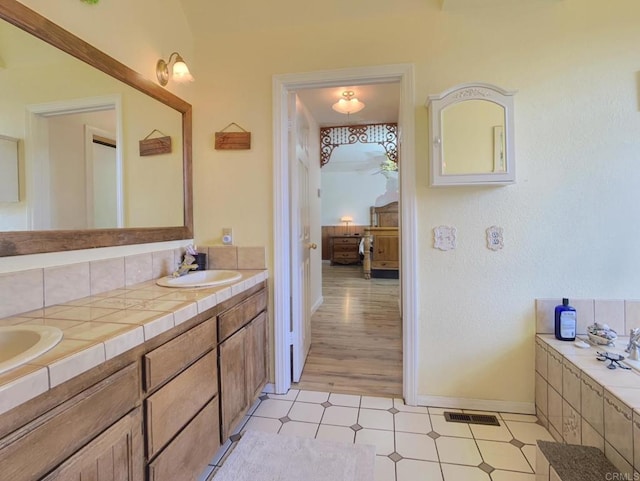 bathroom featuring vanity and hardwood / wood-style flooring