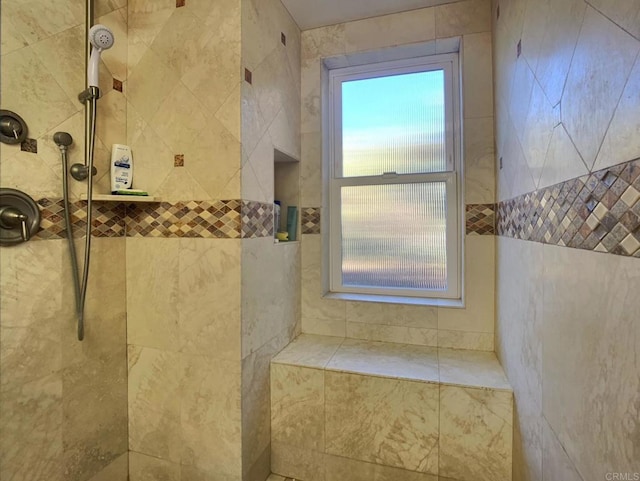 bathroom featuring a tile shower