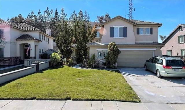 view of property featuring a front yard and a garage