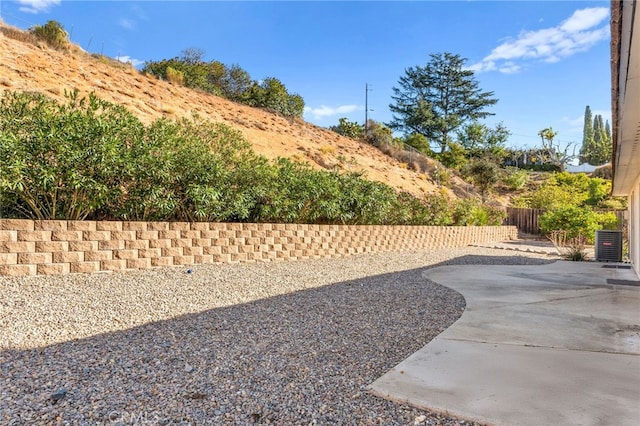 view of yard featuring a patio and central AC unit